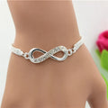 Mit Strasssteinen besetztes, luxuriöses Infinity-Armband aus Zinklegierung