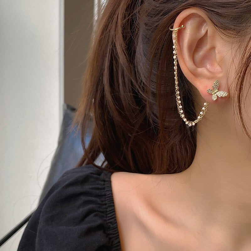 Mit Strasssteinen besetzte, skurrile Engelsflügel-Ohrhänger-Kollektion