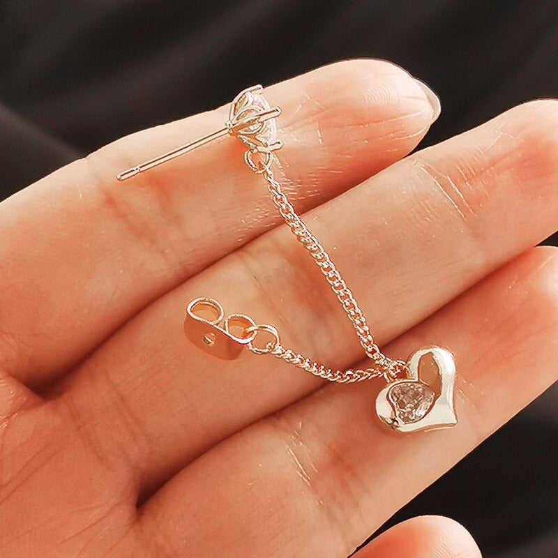 Romantische Ohrringe mit langen Quasten und Herzanhängern und Zirkonia