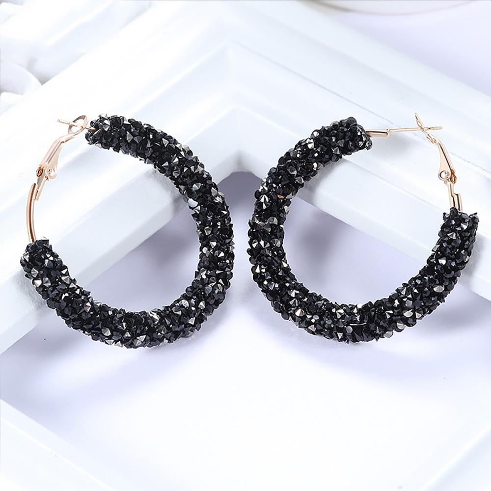 Runde schillernde baumelnde Ohrringe