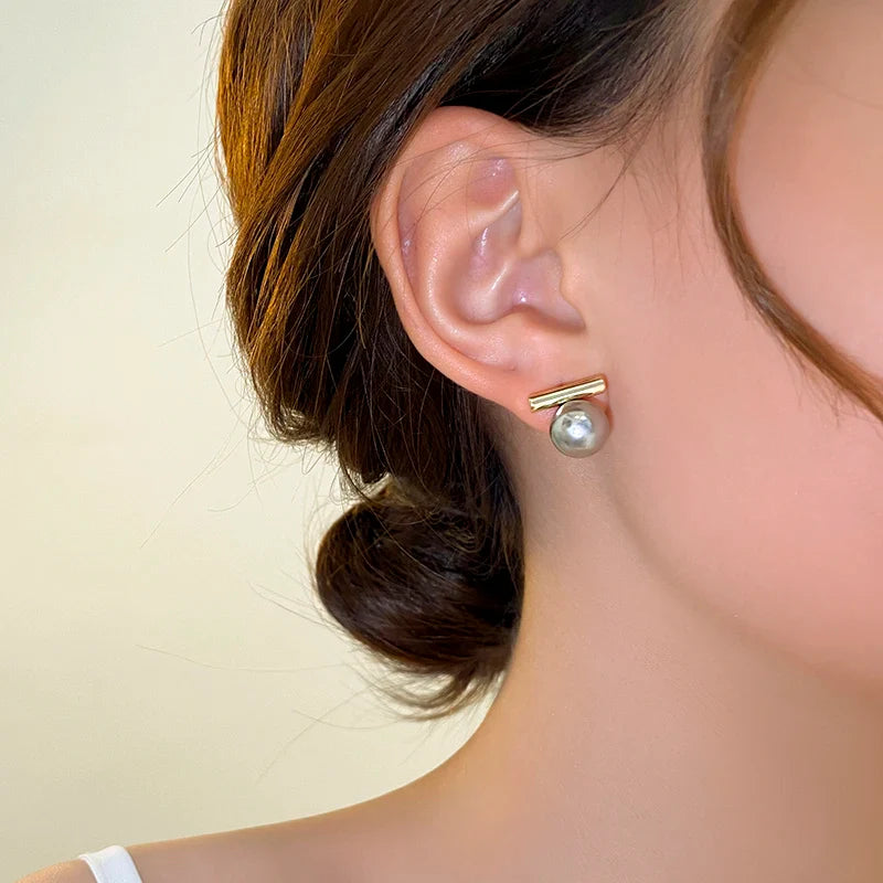 Ohrringe mit rundem Perlenanhänger