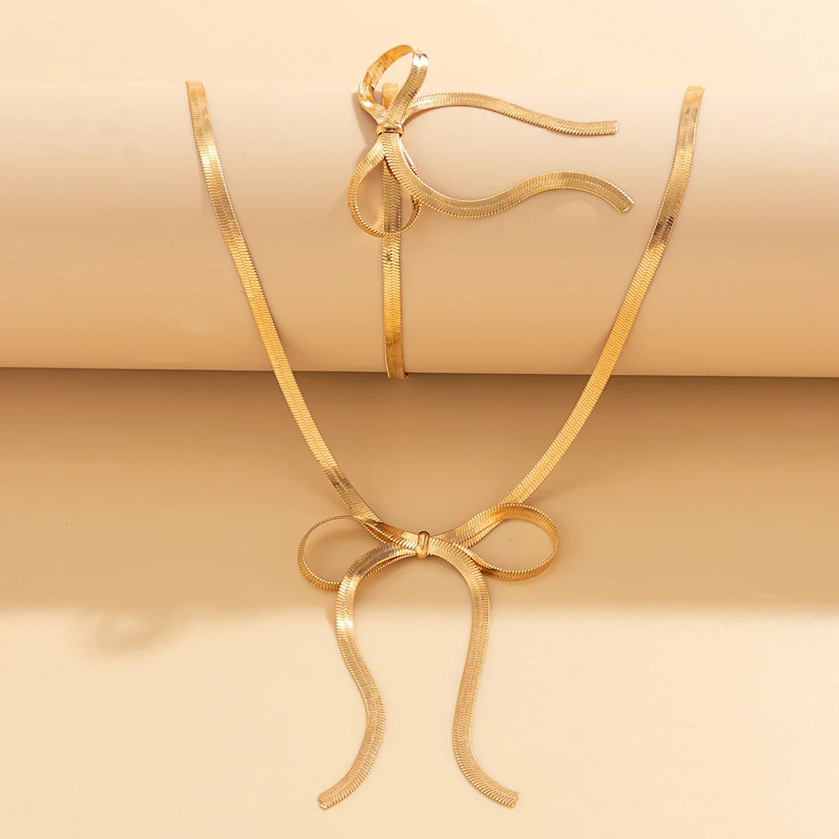 Set aus Halskette und Armband mit Schleife