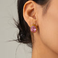 Goldohrring mit rosa Stein