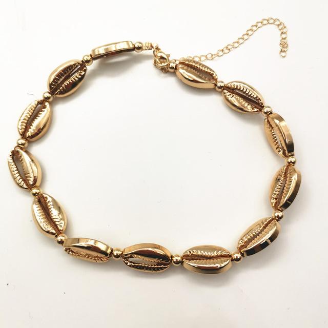 Halskette und Armband mit Muschel- und Perlenanhänger