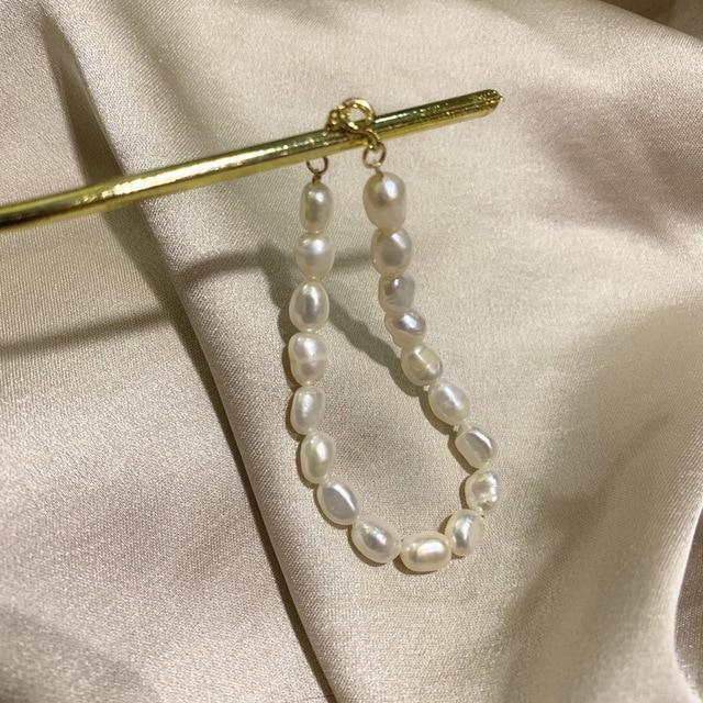 Halskette und Armband mit Muschel- und Perlenanhänger