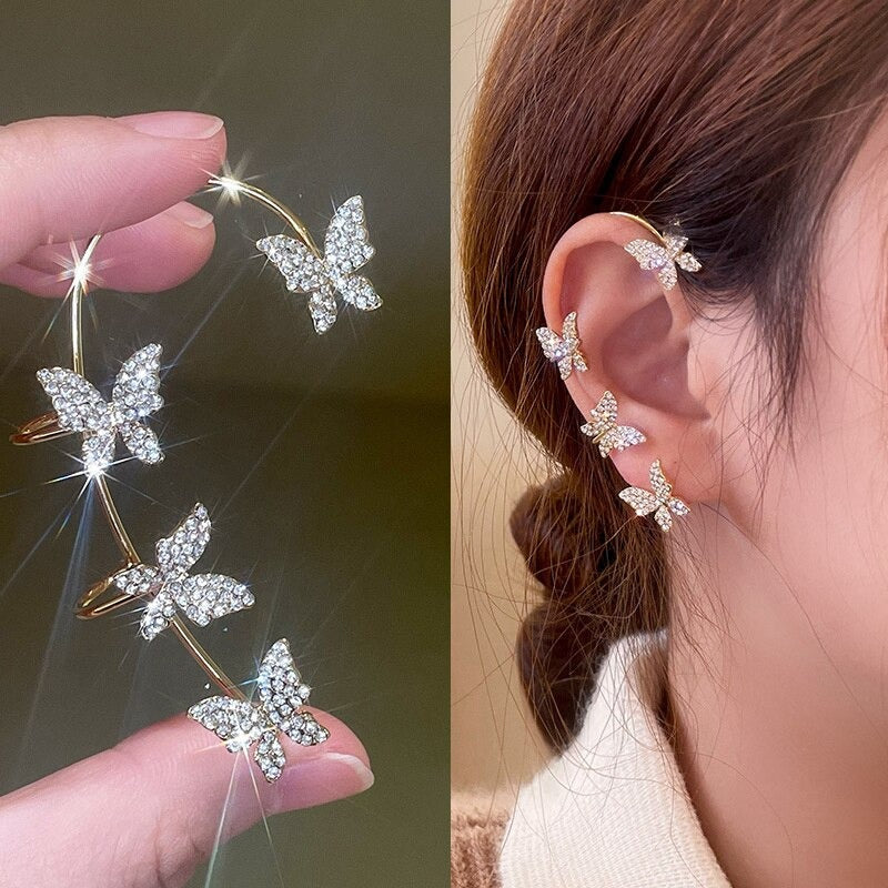 Glänzende, mit Strasssteinen besetzte, lange Quastenohrringe mit Knorpelmanschette