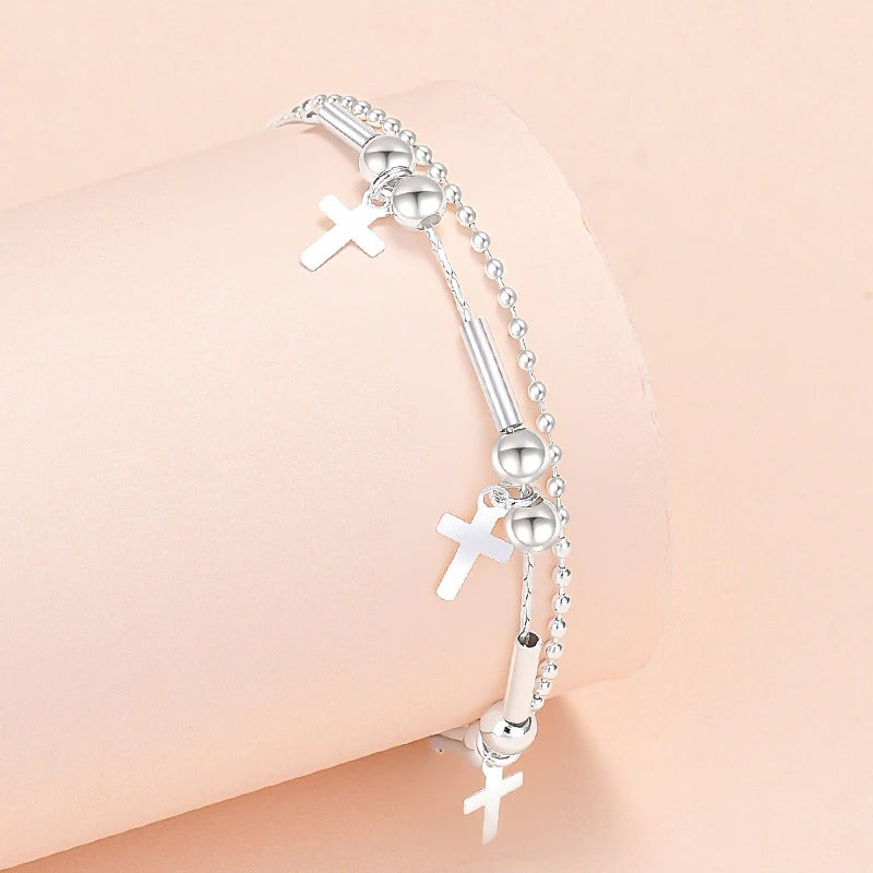 Armbandkollektion mit Schmetterlings- und Kreuz-Charms aus Sterlingsilber