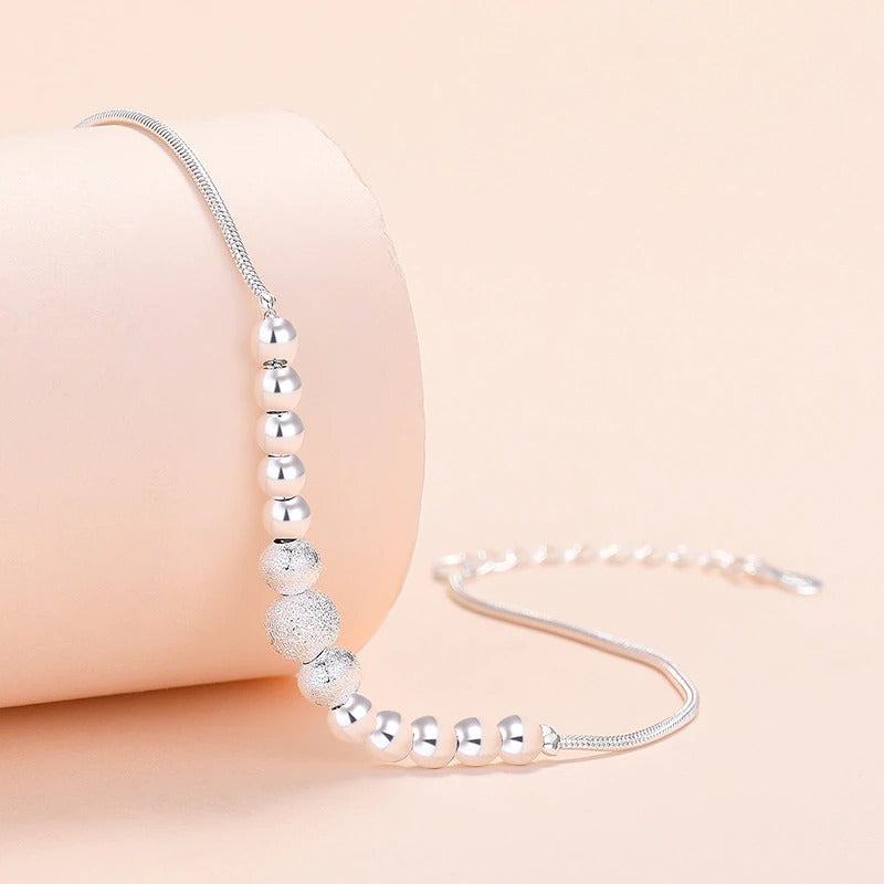 Armbandkollektion mit Schmetterlings- und Kreuz-Charms aus Sterlingsilber