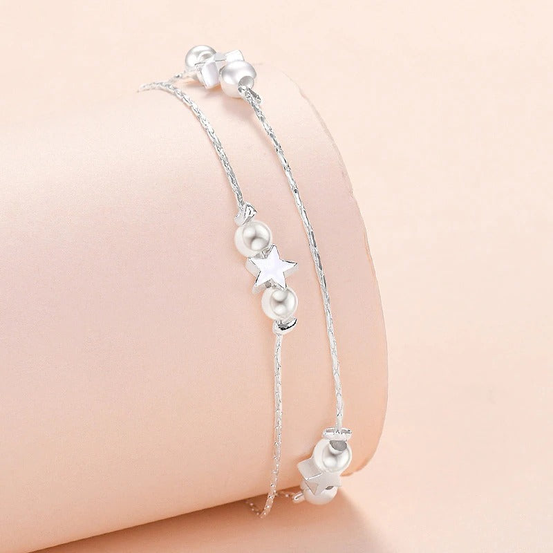 Armbandkollektion mit Schmetterlings- und Kreuz-Charms aus Sterlingsilber