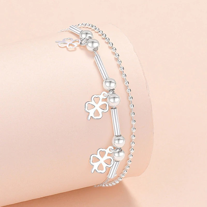 Armbandkollektion mit Schmetterlings- und Kreuz-Charms aus Sterlingsilber