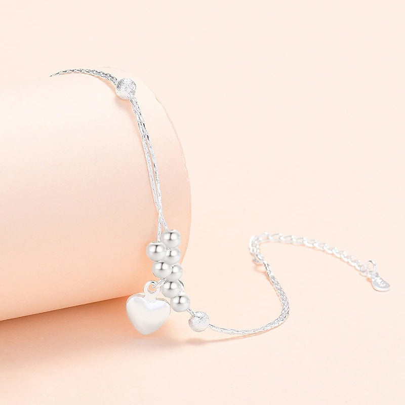 Armbandkollektion mit Schmetterlings- und Kreuz-Charms aus Sterlingsilber