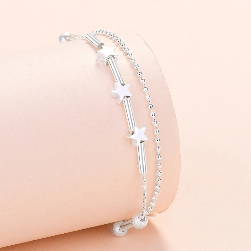 Armbandkollektion mit Schmetterlings- und Kreuz-Charms aus Sterlingsilber