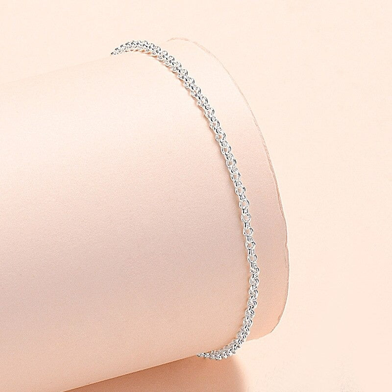 Armbandkollektion mit Schmetterlings- und Kreuz-Charms aus Sterlingsilber