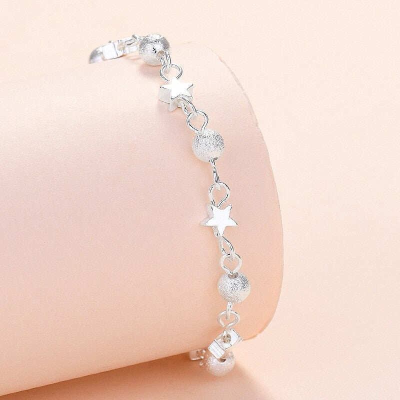 Armbandkollektion mit Schmetterlings- und Kreuz-Charms aus Sterlingsilber