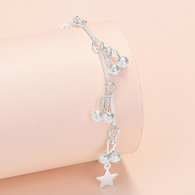 Armbandkollektion mit Schmetterlings- und Kreuz-Charms aus Sterlingsilber