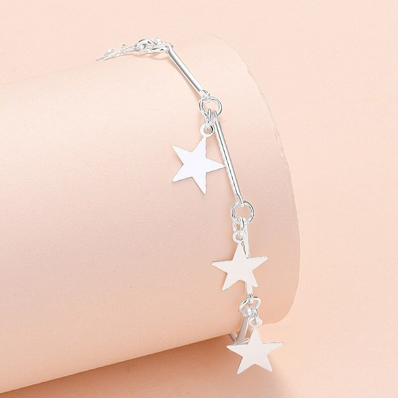 Armbandkollektion mit Schmetterlings- und Kreuz-Charms aus Sterlingsilber