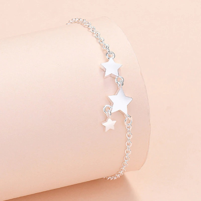 Armbandkollektion mit Schmetterlings- und Kreuz-Charms aus Sterlingsilber