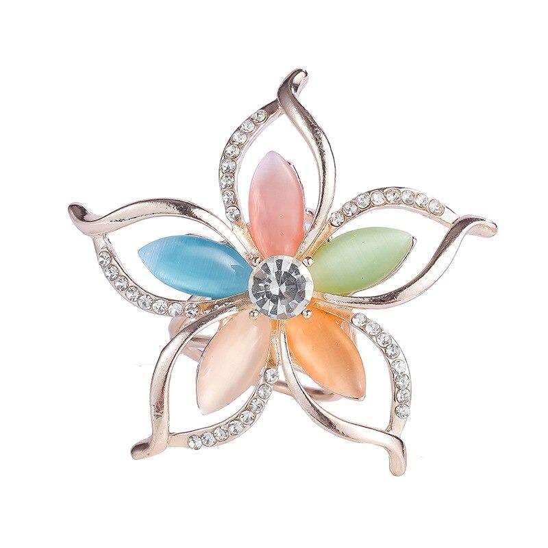 Leuchtender Schalschnallenring mit Strasssteinen und Perlen