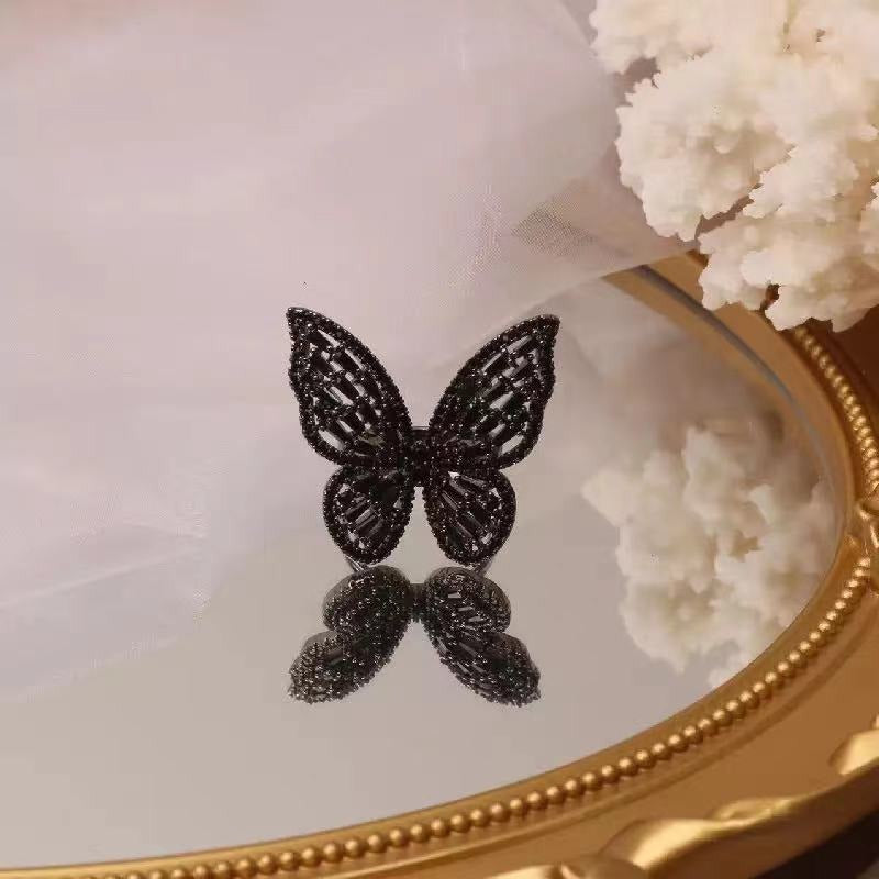 Wunderliche mit Zirkonen verzierte schwarze Schmetterlingsringe