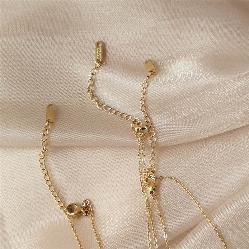 Halsketten mit Zirkonia-Herz und Engelsflügel-Anhänger