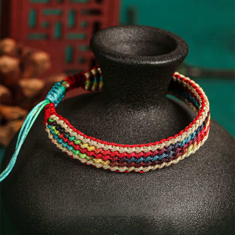 Carmiora Tibet Handgefertigtes, regenbogenfarbenes, geflochtenes Schutzarmband