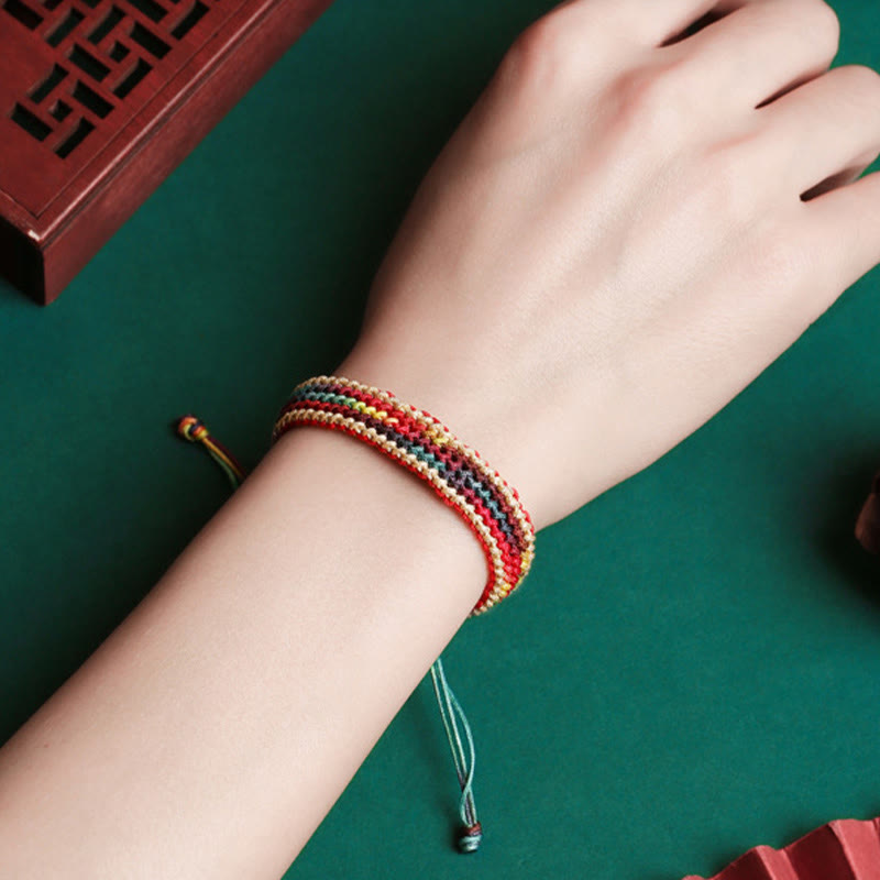 Carmiora Tibet Handgefertigtes, regenbogenfarbenes, geflochtenes Schutzarmband