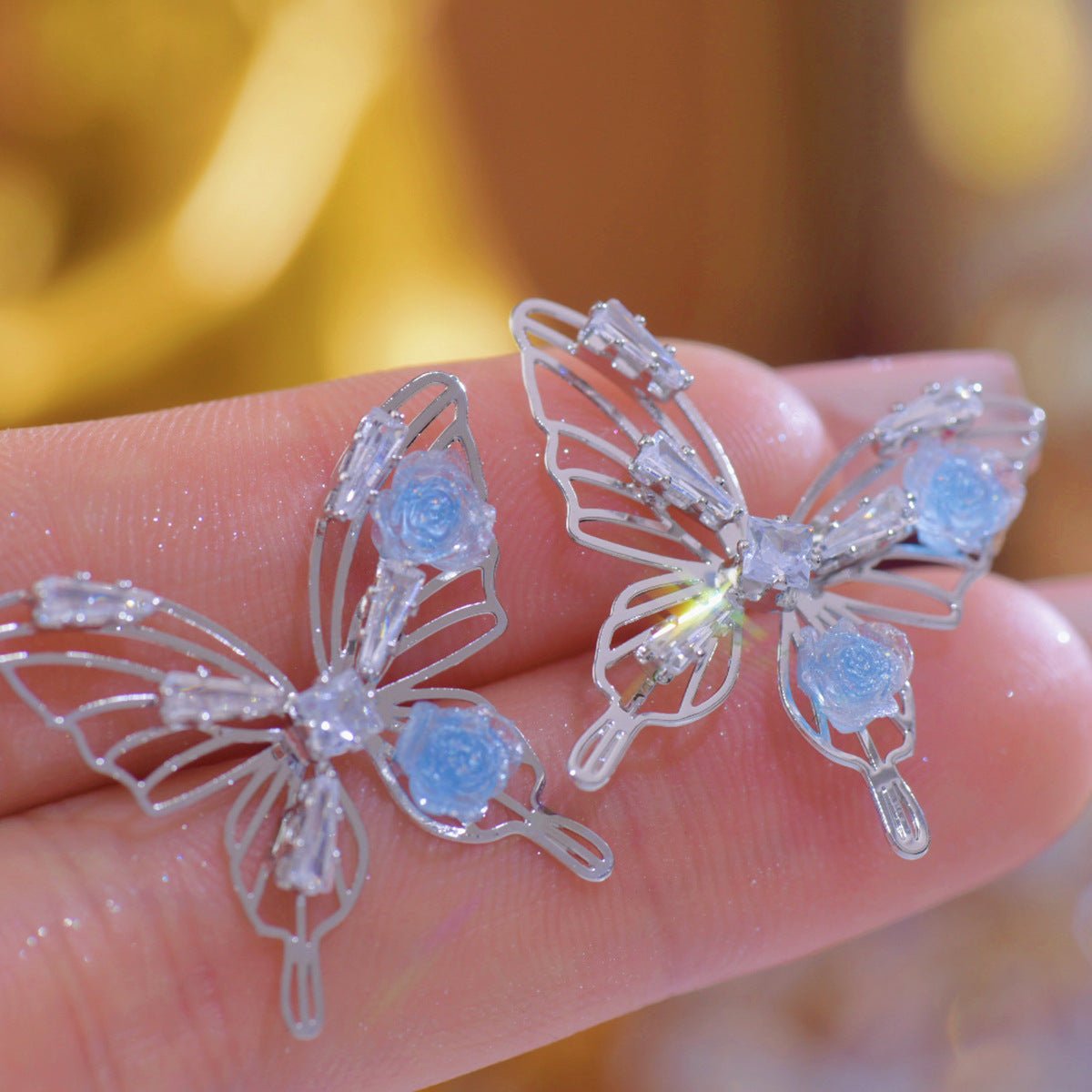 Blaue Rosen-Schmetterlings-Ohrringe