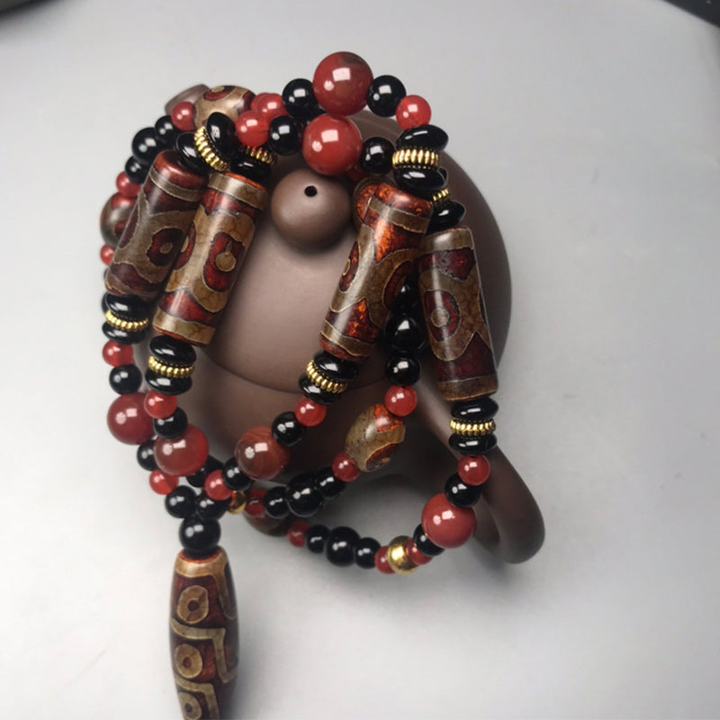 Carmiora Nine-Eye Dzi Bead Red Agate Wealth Health Halskette