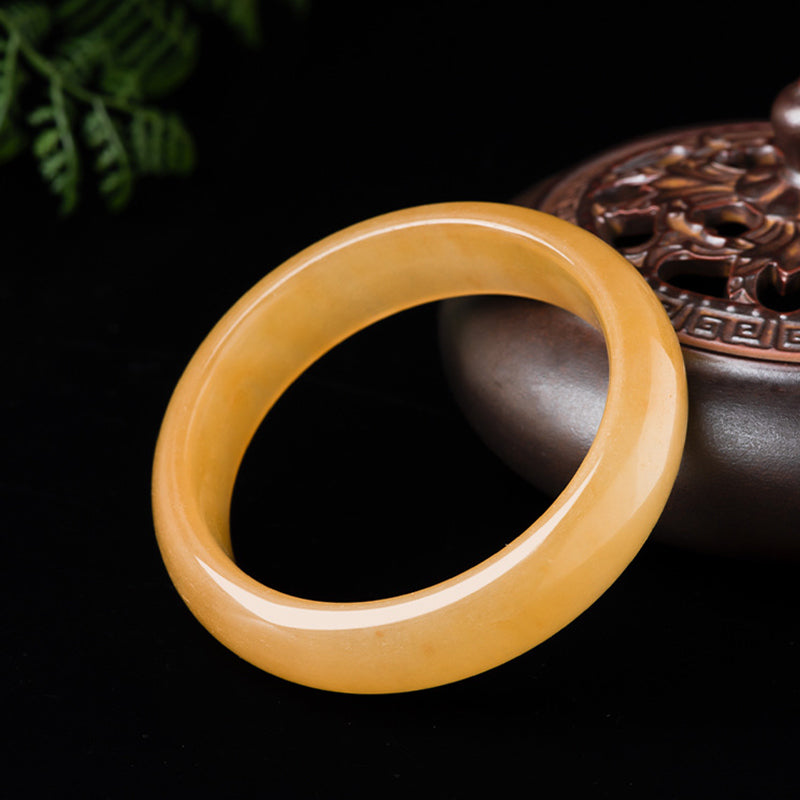 Carmiora Reichtumsarmband aus natürlicher goldener Seide und Jade