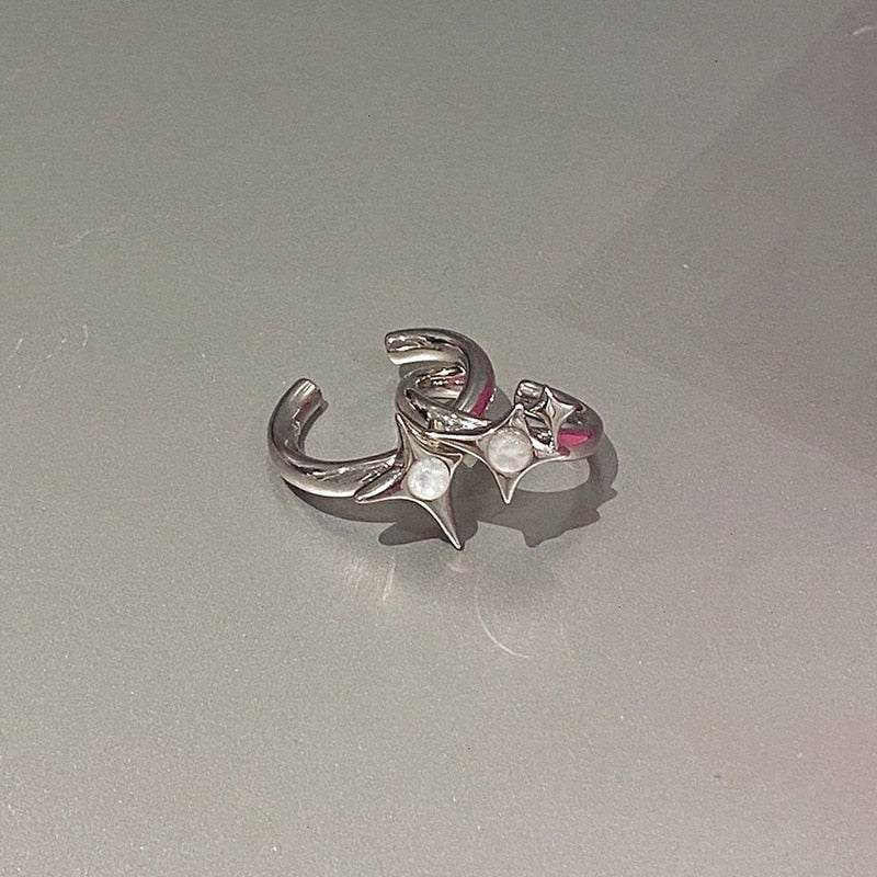 Kollektion unregelmäßiger Kreuzstern-Mondsteinringe