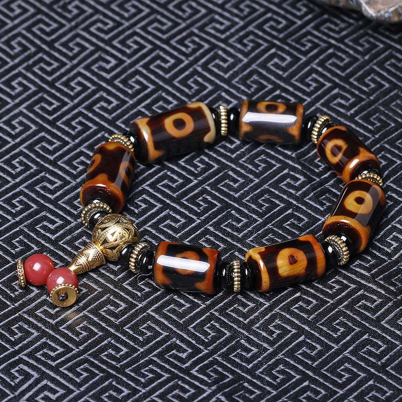 Carmiora Tibetisches Neun-Augen-Dzi-Perlen-Glücks-Charm-Armband