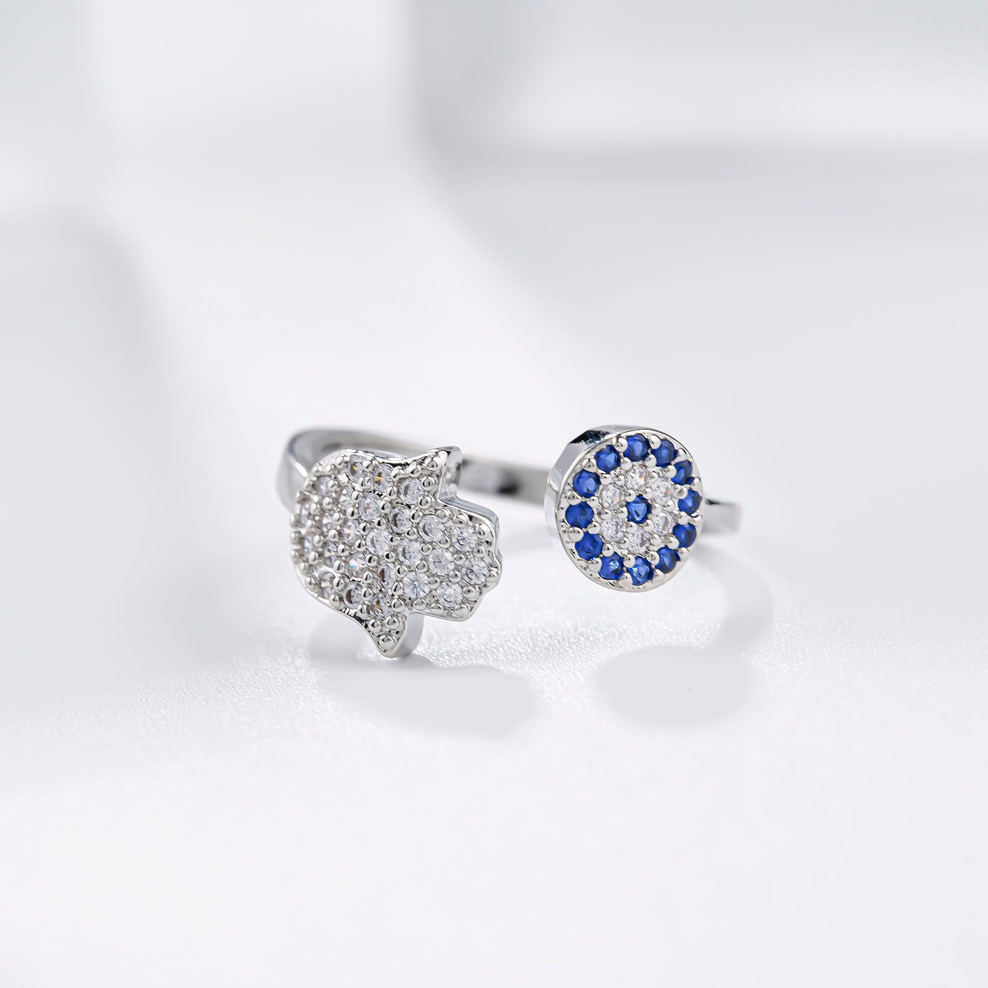 Ring mit bösem Blick und Hamsa-Hand
