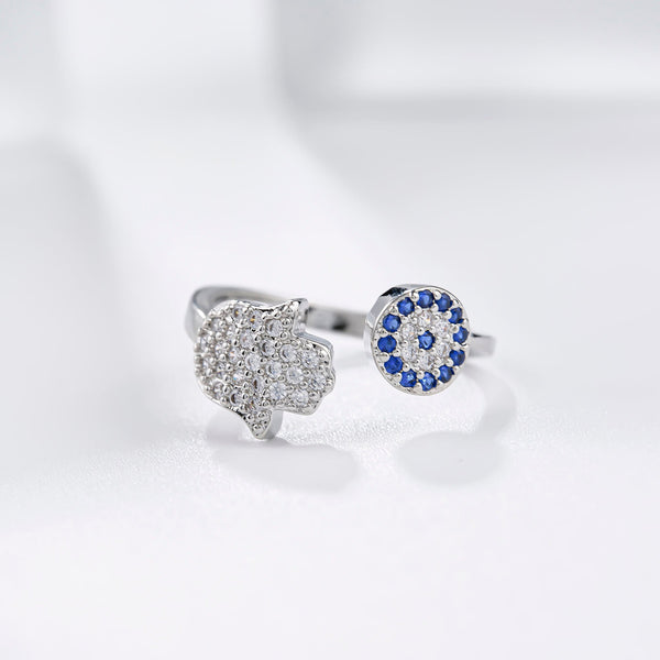 Ring mit bösem Blick und Hamsa-Hand