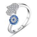 Ring mit bösem Blick und Hamsa-Hand