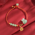 Carmiora 925 Sterling Silber Jahr des Kaninchens Hetian Jade Glück Glück rote Schnur Armband