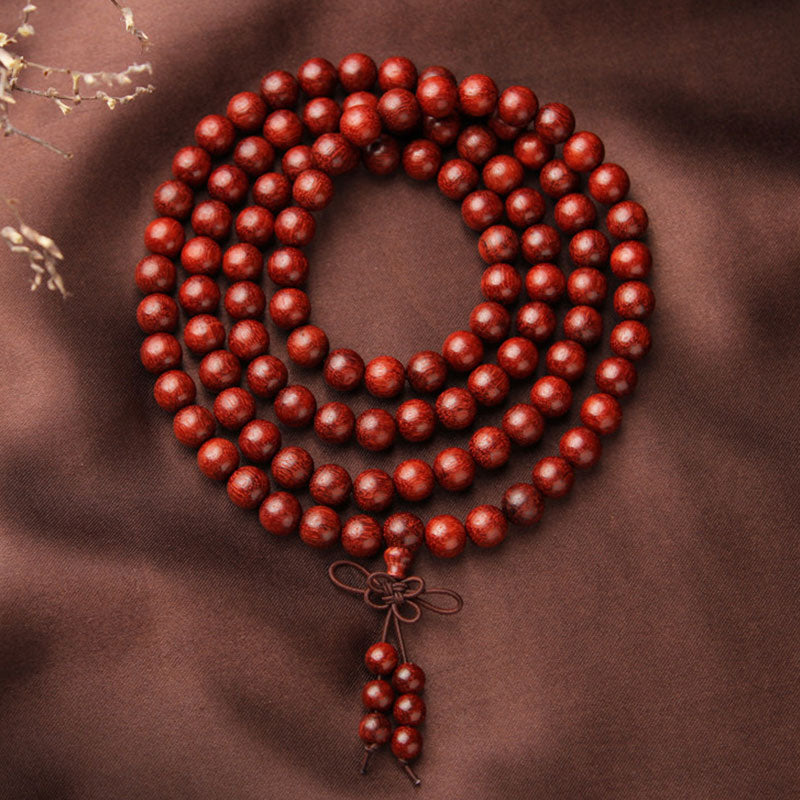 Carmiora Tibetisches Mala-Meditationsarmband mit kleinen Blättern aus rotem Sandelholz und 108 Perlen
