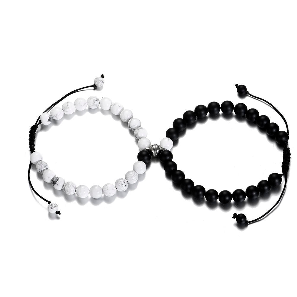 Magnetische Paararmbänder aus Howlith und mattschwarzem Achat mit schwarzem Seil