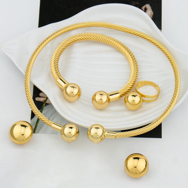 Hochglanzpoliertes Schmuckset mit runden Kugeln