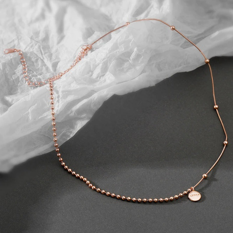 Asymmetrische Perlenkette mit Chokerhalsketten mit Glücksbringer-Anhänger