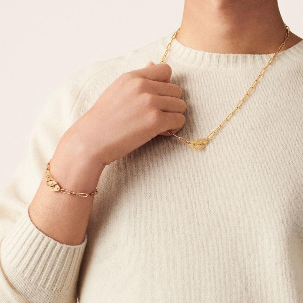 Halskette mit Büroklammer-Handschellen