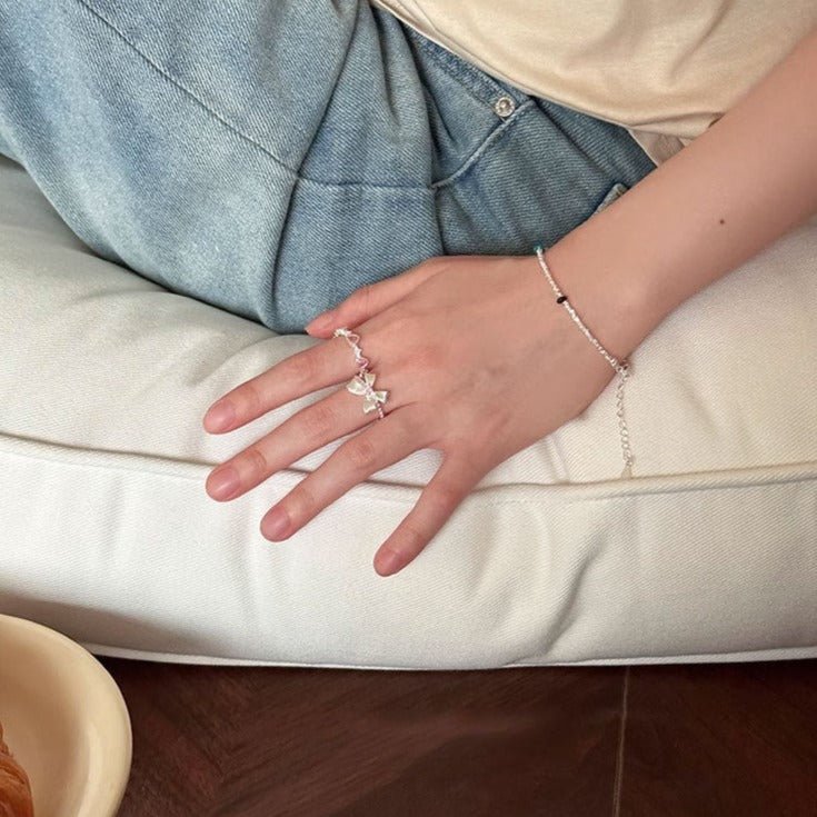 Schleifenring mit rosa Edelstein (massives Silber)