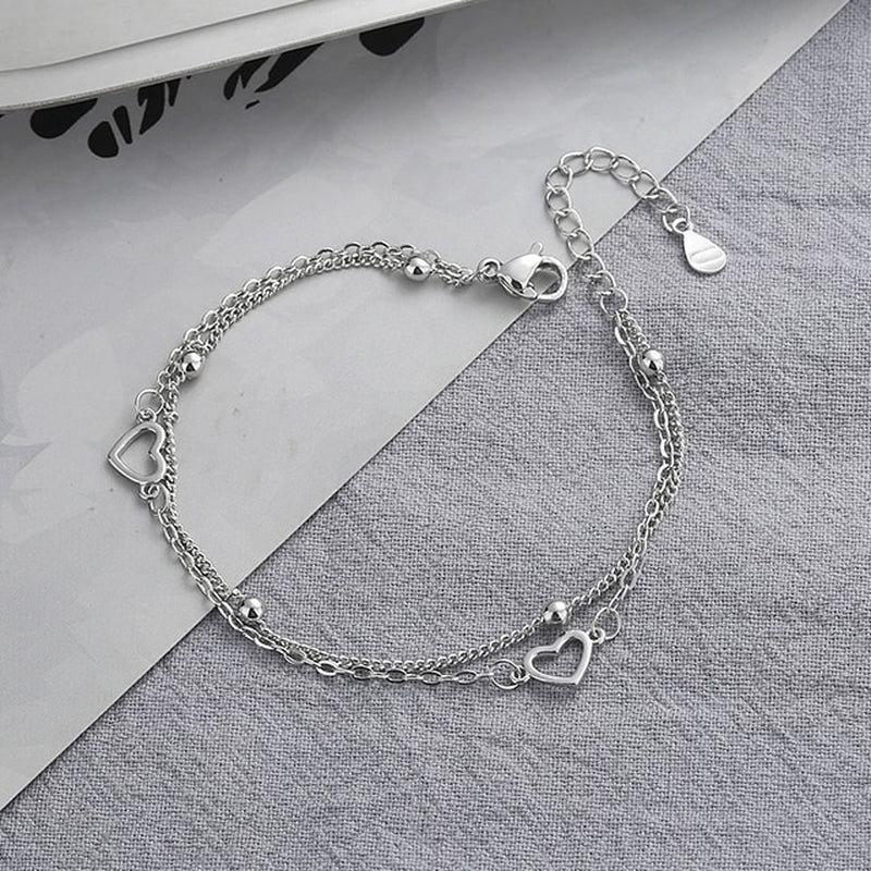 Armband aus Sterlingsilber mit doppeltem Liebesherz und hohlen runden Perlen