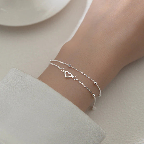 Armband aus Sterlingsilber mit doppeltem Liebesherz und hohlen runden Perlen