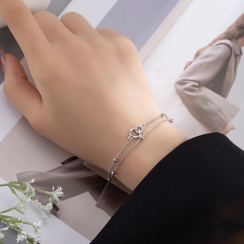 Armband aus Sterlingsilber mit doppeltem Liebesherz und hohlen runden Perlen