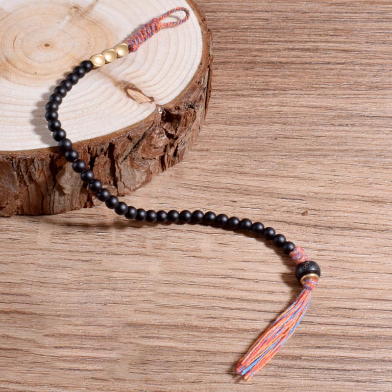 Handgefertigtes Chavri-Quastenarmband aus tibetischem schwarzem Onyx
