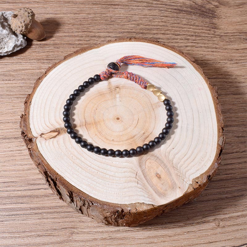 Handgefertigtes Chavri-Quastenarmband aus tibetischem schwarzem Onyx