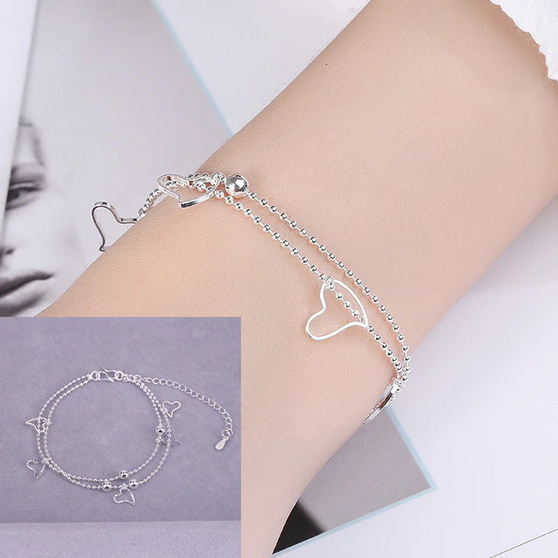 Armband aus Sterlingsilber mit doppeltem Liebesherz und hohlen runden Perlen