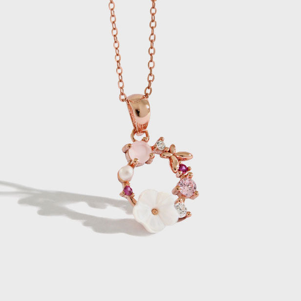 Wunderschöne Halskette aus 925er-Sterlingsilber mit rosa CZ und weißer Muschelblumengirlande