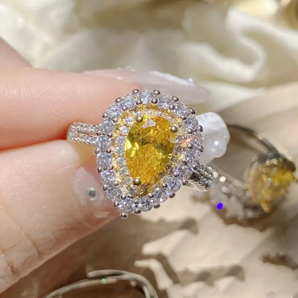 Eleganter Damenring mit gelbem Kristall und geometrischem Design