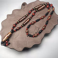 Chavri Nine-Eye Dzi Bead Red Agate Wealth Health Halskette